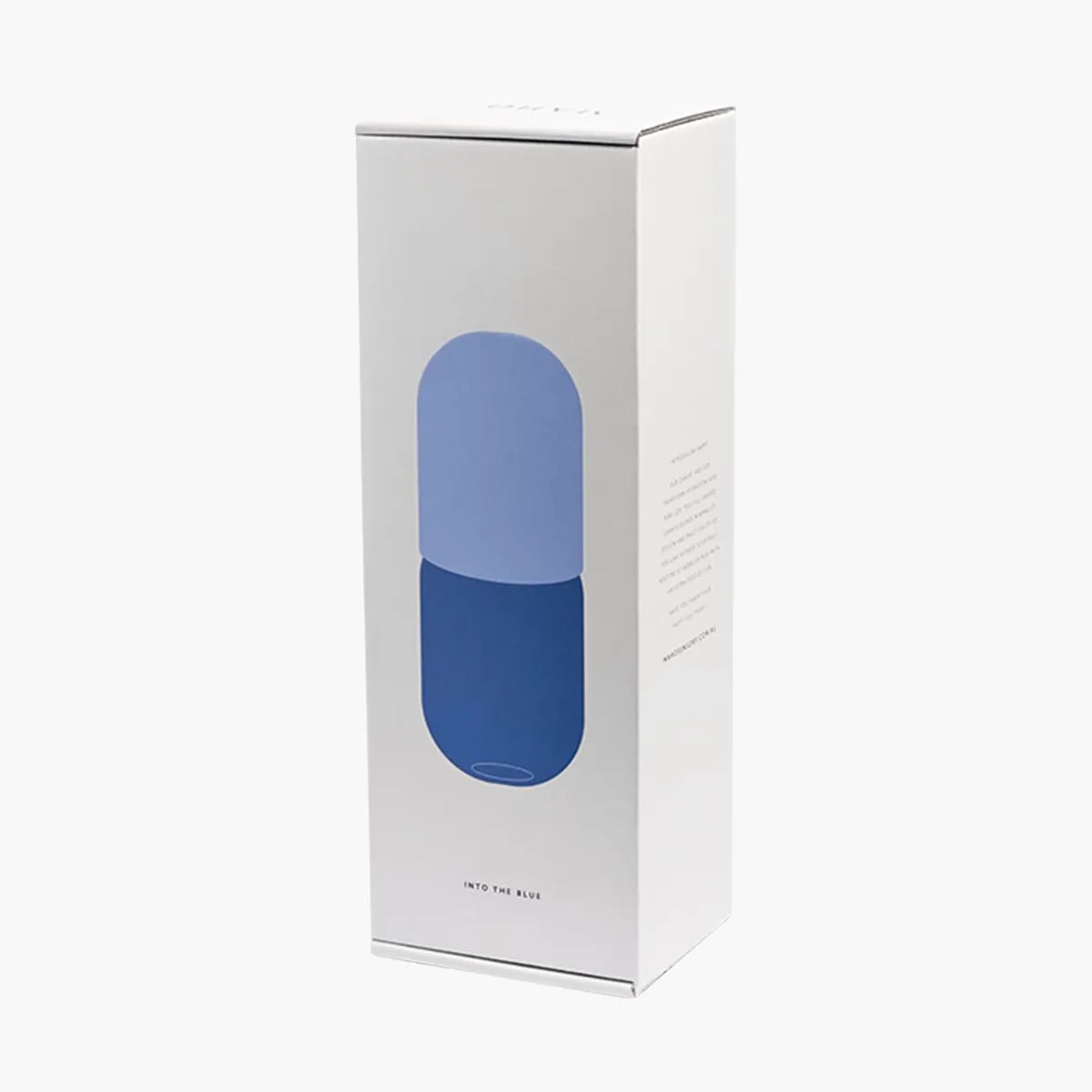 White box with a blue carafe and cup set inside on a white background