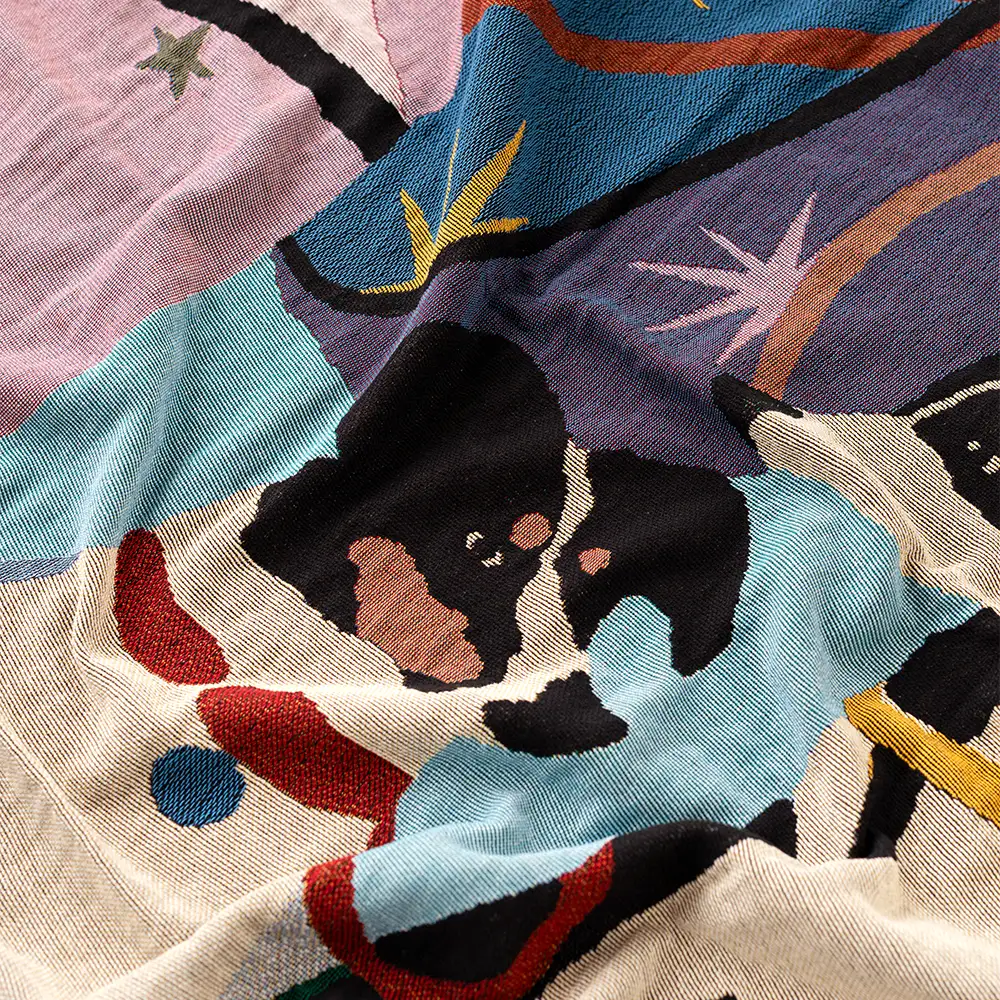 Colorful woven throw with a dog design and abstract patterns