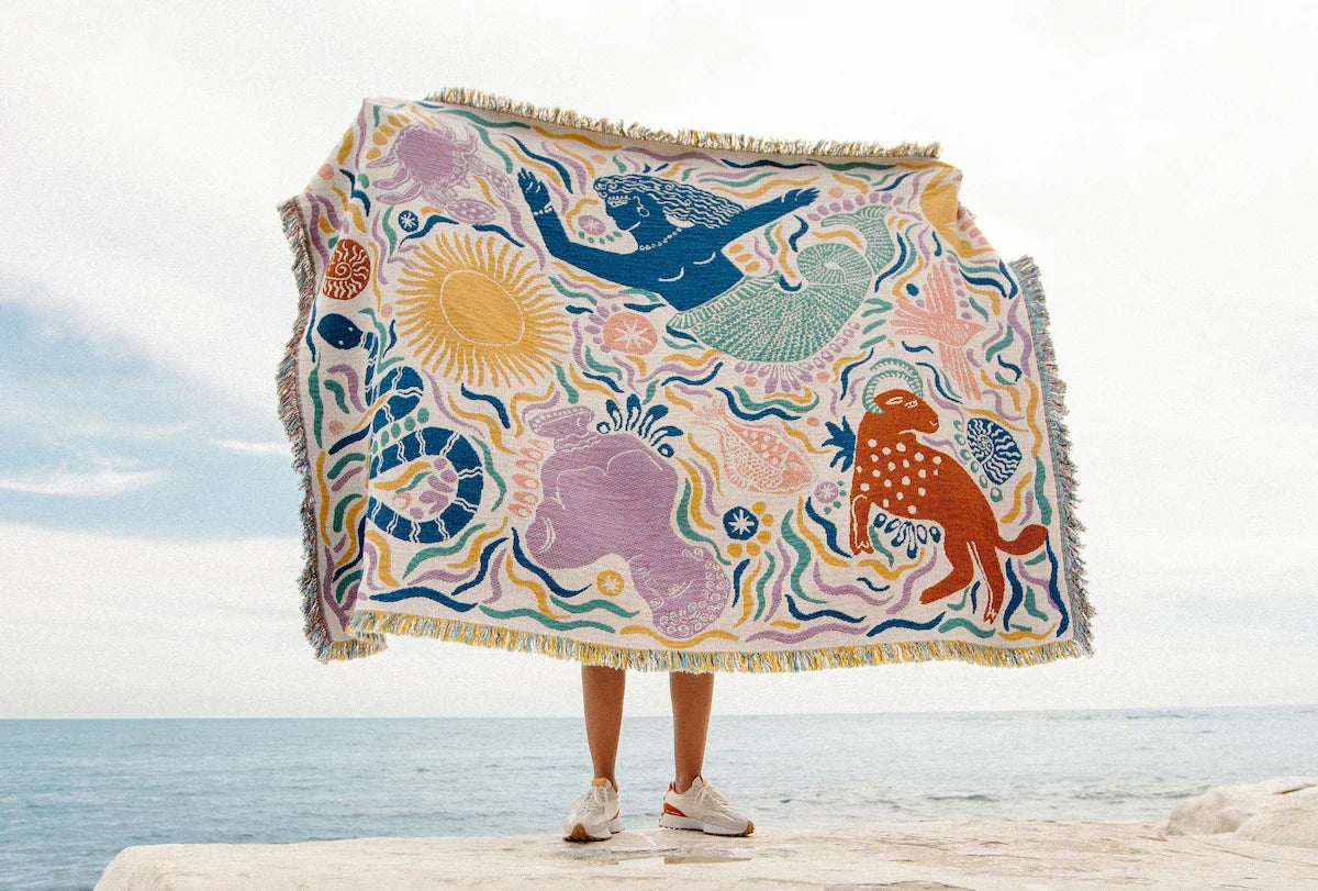Bed blanket with colourful pattern of mythical creatures
