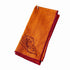 Orange napkin with a cheese design on a white background
