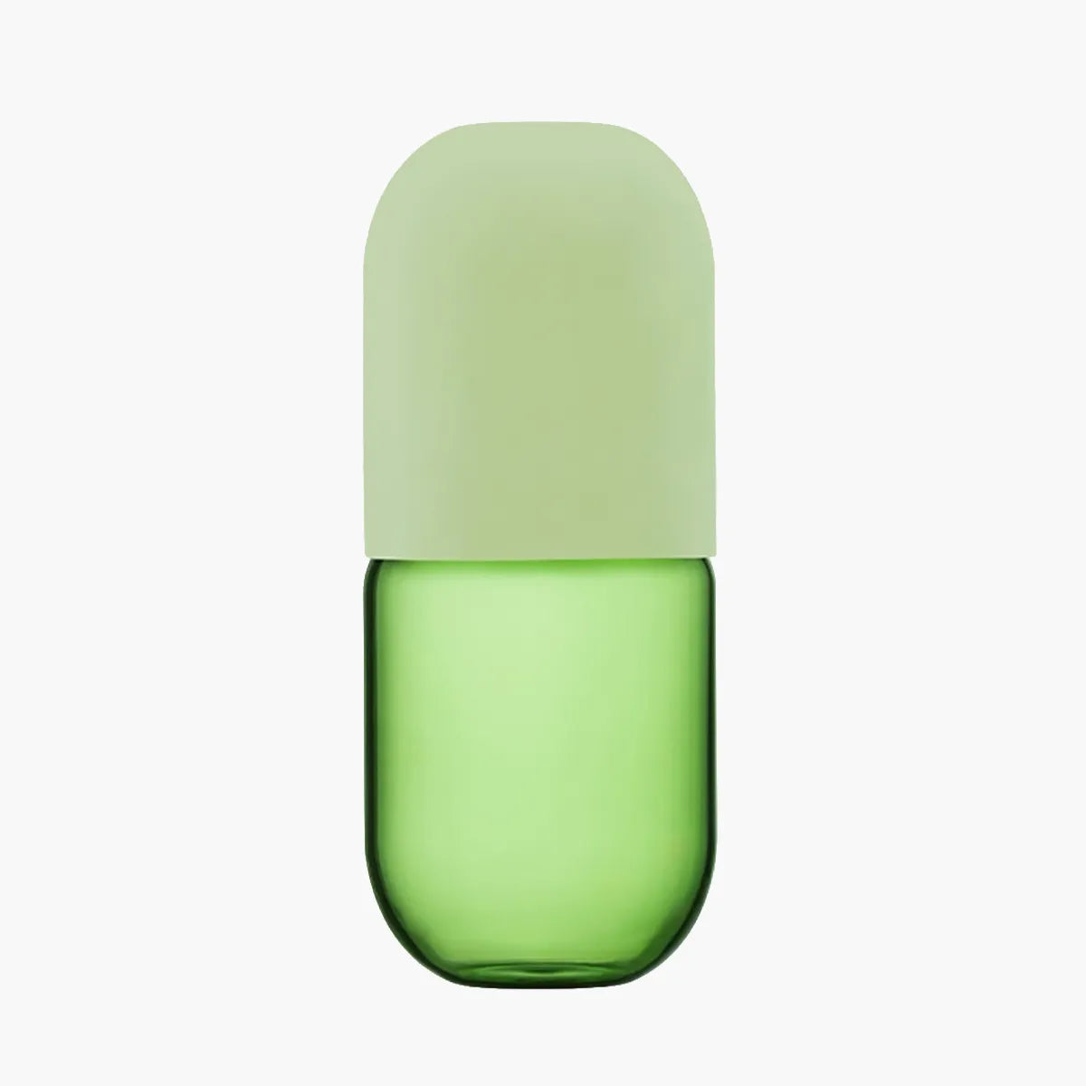 Green glass carafe with a light green lid on a white background