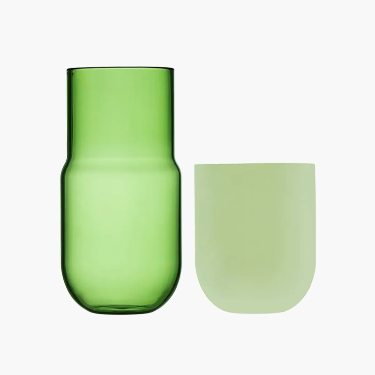 Green glass carafe and cup on a white background