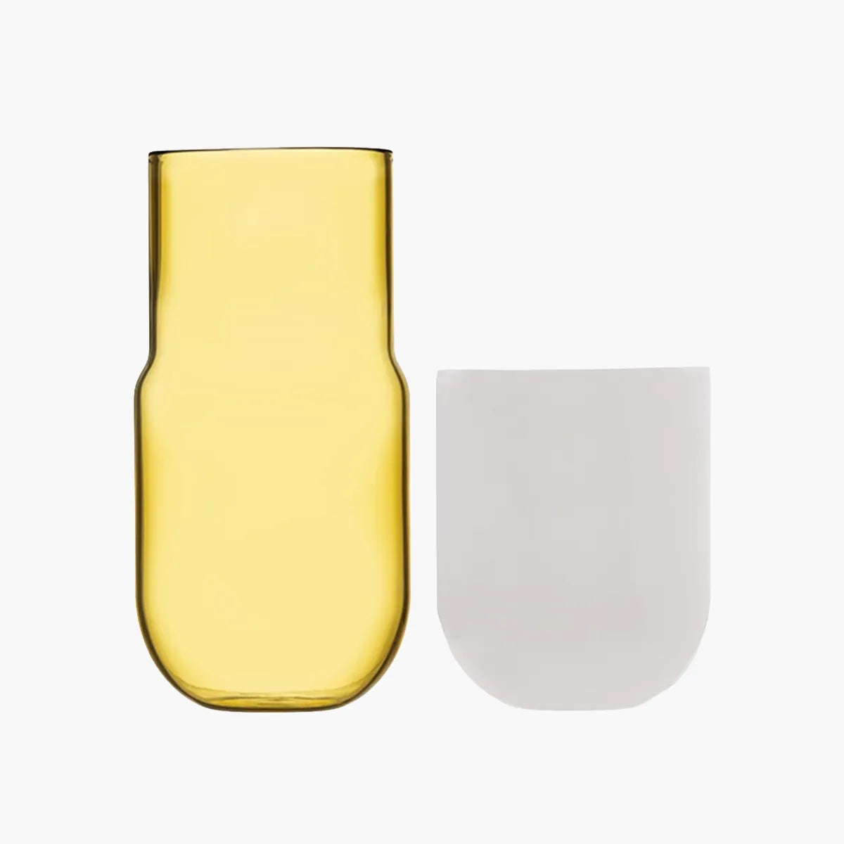 Yellow glass carafe and white cup on a white background