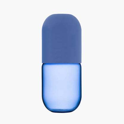 Blue cylindrical carafe with a blue lid on a white background