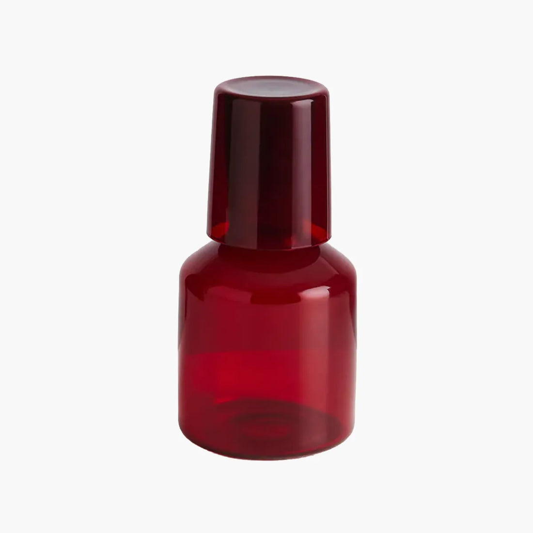 Red carafe and glass set on a white background