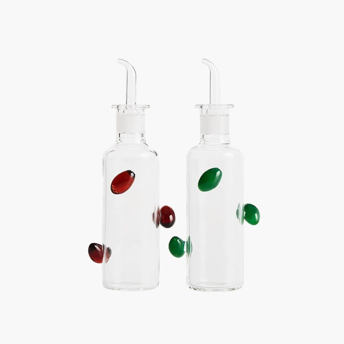 Two clear glass bottles with colorful knobs on a white background