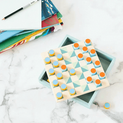 Looping video of a wooden board game with colorful cylindrical pieces on a marble stone table