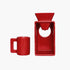Red ceramic coffee maker with a mug on a white background
