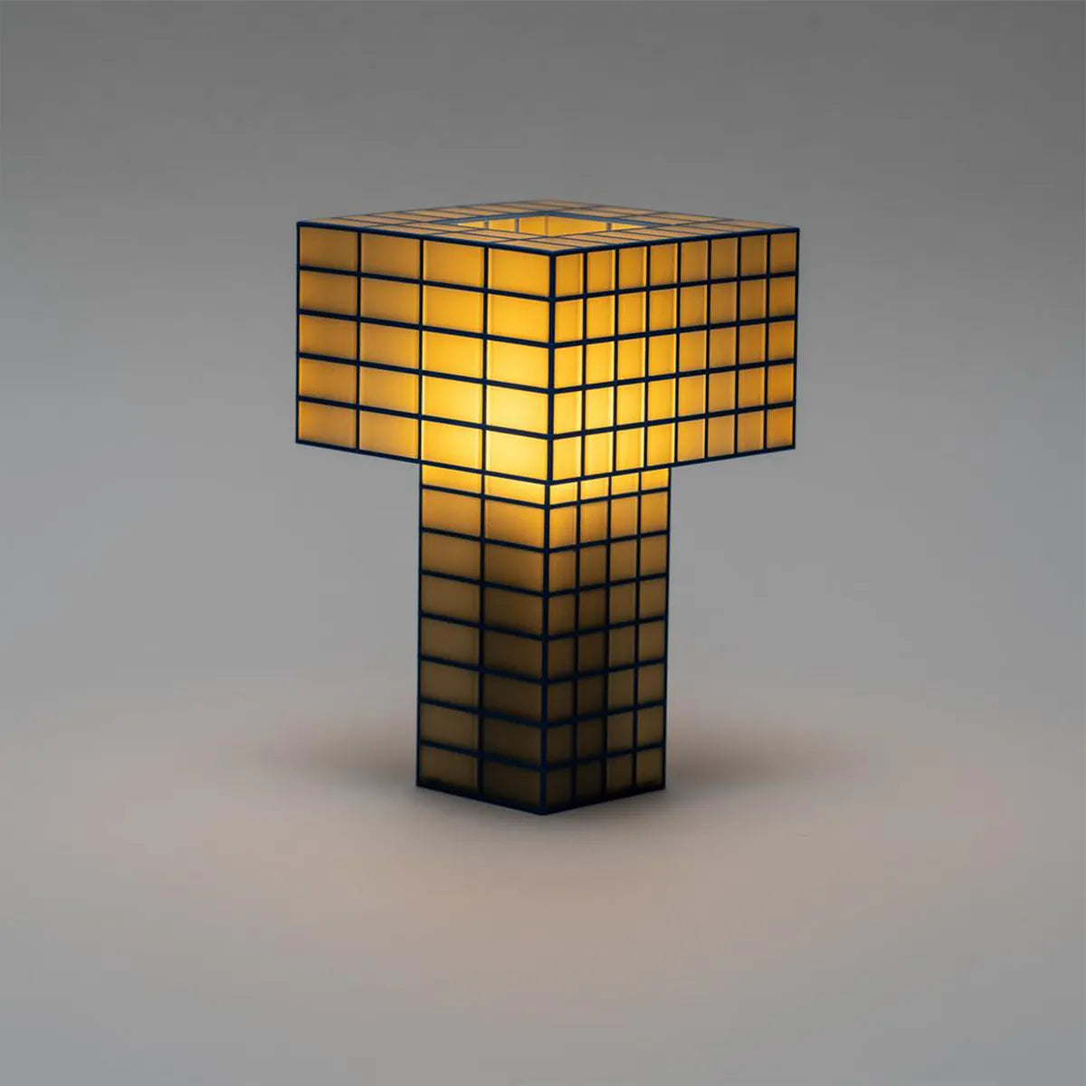 A Ridezign Tesser 5:8 table lamp shaped like the letter &