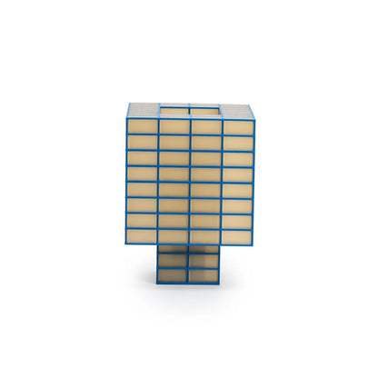 A Ridezign Tesser 8:3 Lamp featuring a blue metal frame with a grid of warm beige glass or acrylic panels, standing on a matching blue base against a white background.