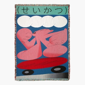 Suzuki Throw - Slowdown Studio. Artist-designed woven throw blanket with a Japanese design in blue, pink and white. 