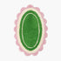 Green oval rug with pink scalloped edge on a white background