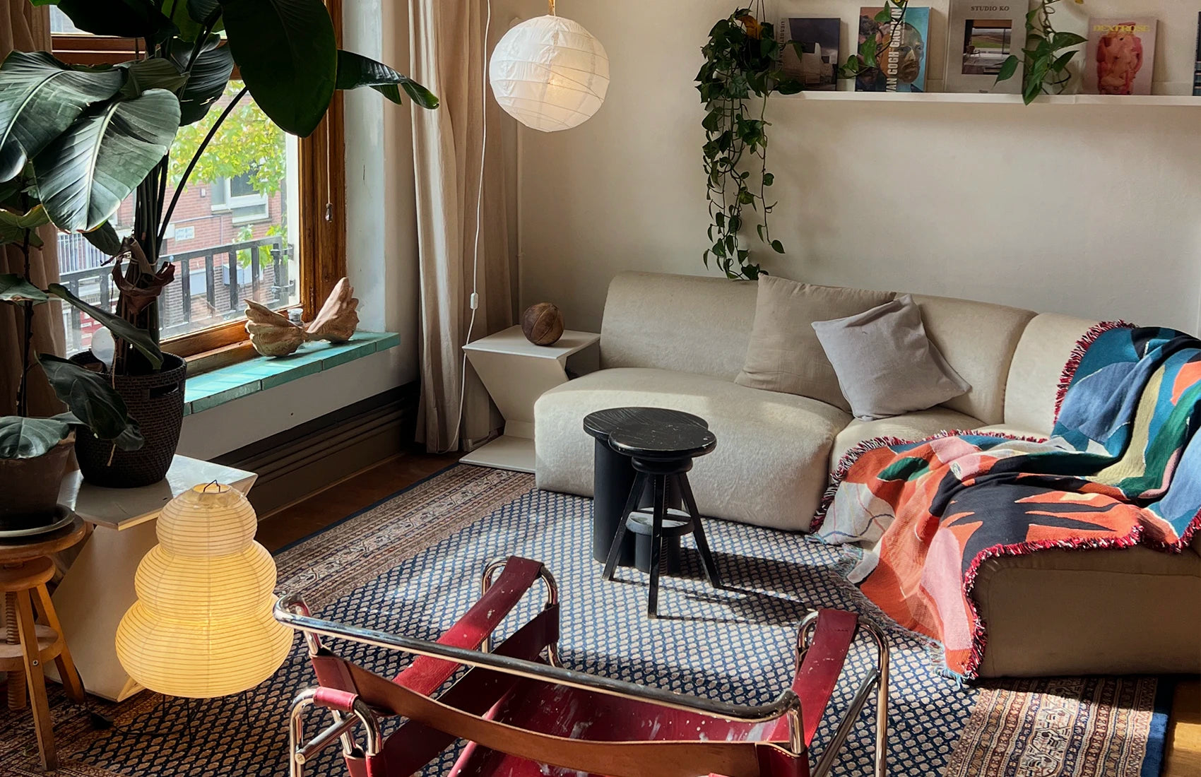 Living room with a sofa, coffee table, and decorative elements.